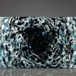 Abstract artwork with swirling black, white, and blue patterns resembling pebbles, creating a hypnotic vortex effect.