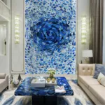 Luxurious living room featuring large abstract blue agate artwork, beige sofas, and a matching blue table with decor.