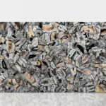 Glossy smooth agate slab featuring intricate gray, black, and beige patterns resembling a natural mosaic.