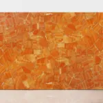 Orange calcite slab with gold accents