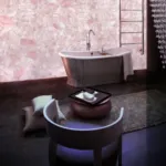 Backlit pink quartz wall in bathroom
