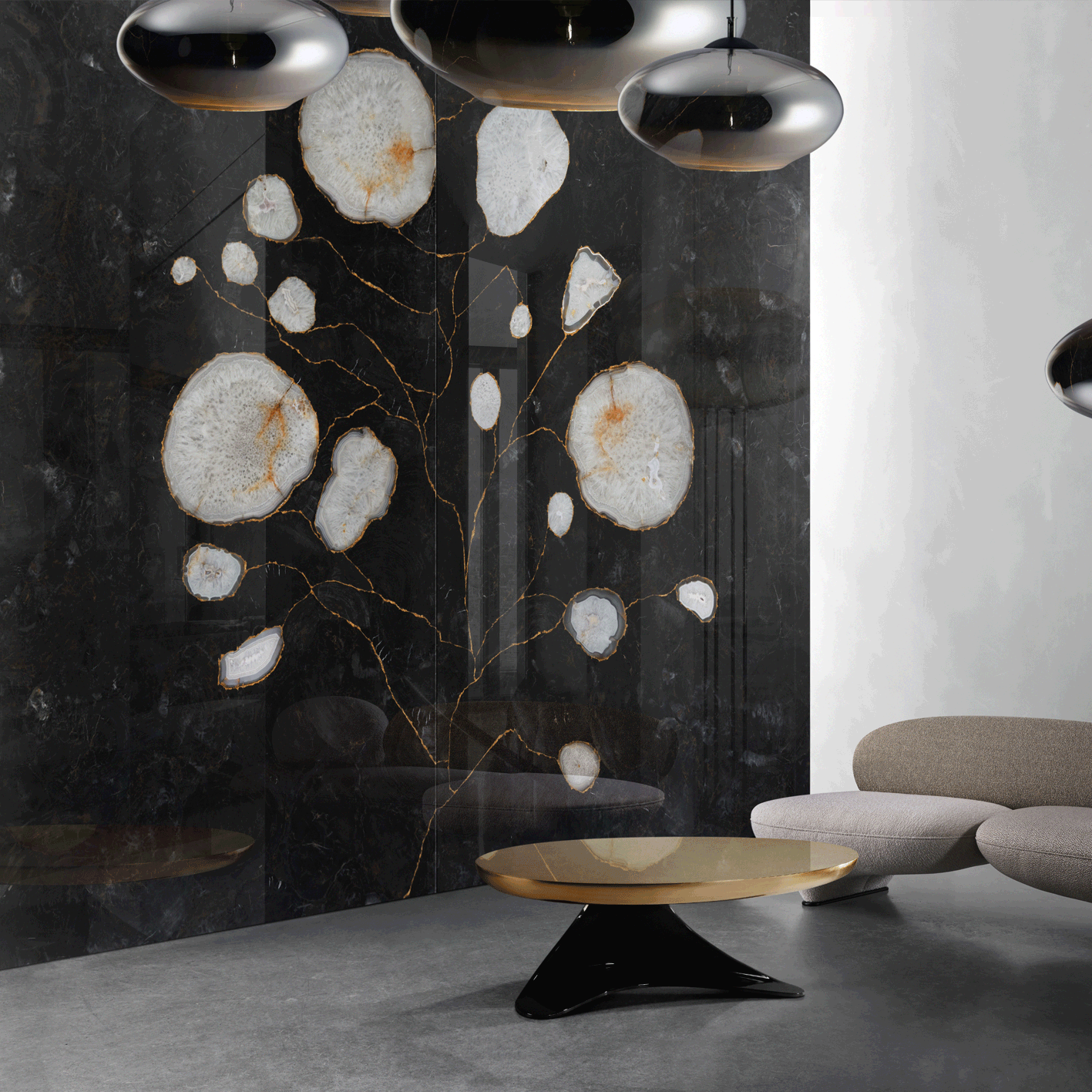 A black and gold coffee table sits in front of a striking black natural stone piece with orange veining and white details